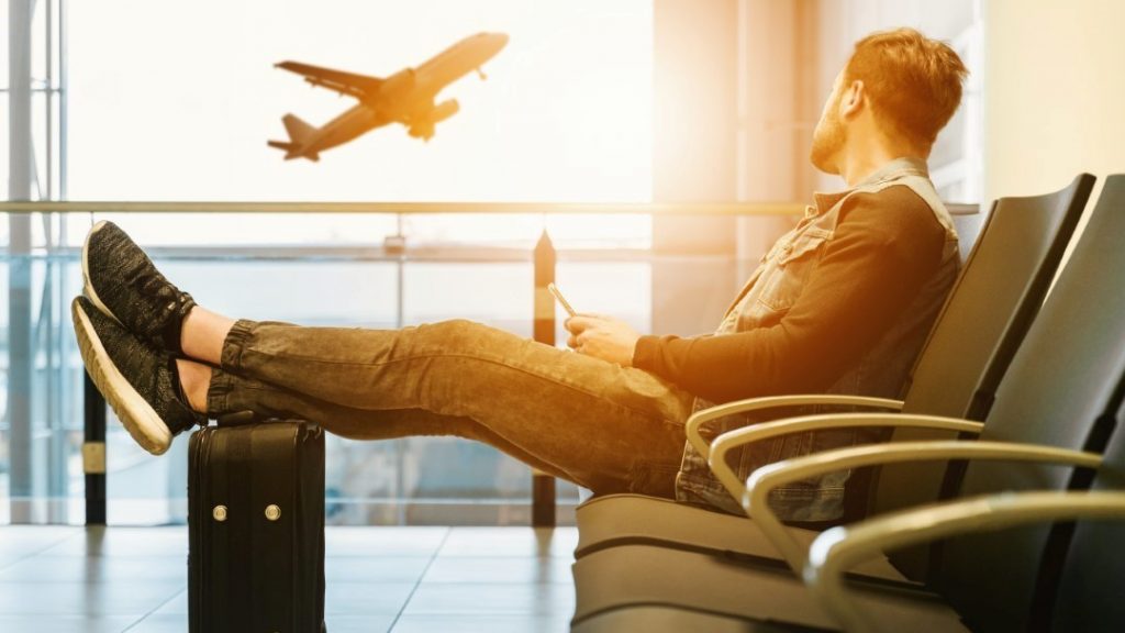 man waiting at airport